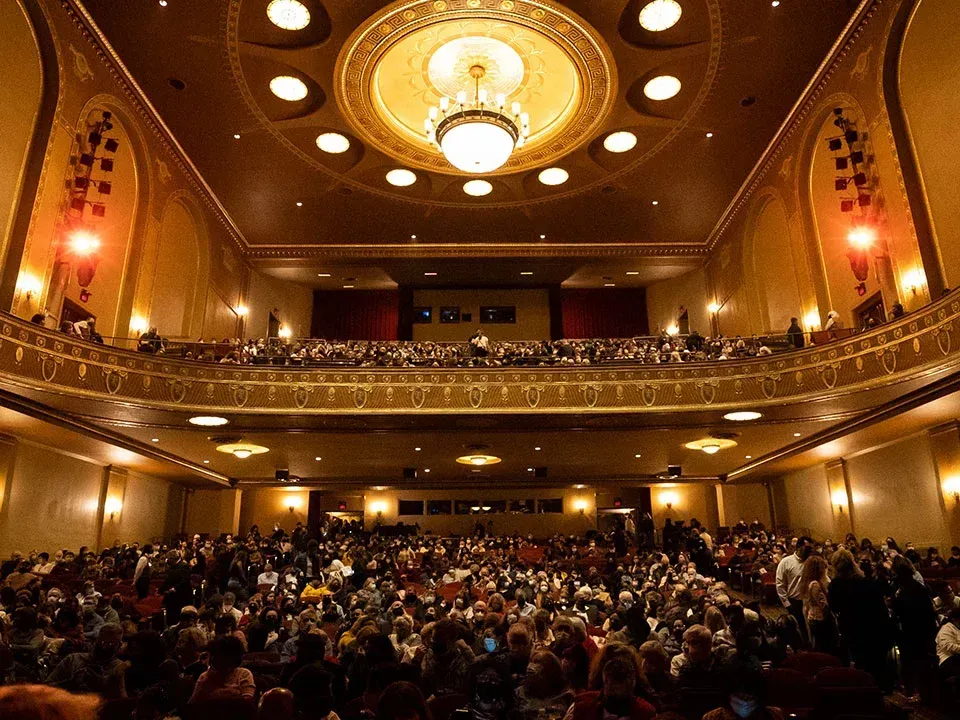 State Theatre New Jersey with ornate gold decor, tiered balconies, and full audience near Garden Executive Hotel