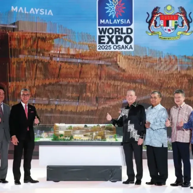 A group of individuals posing for a photo at Expo 2025 Osaka - Lexis Hotels & Resorts