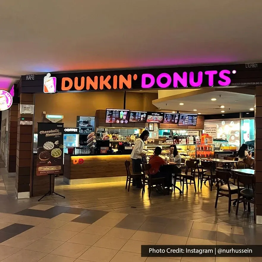 Dunkin Donuts outlet at Penang International Airport with customers dining inside