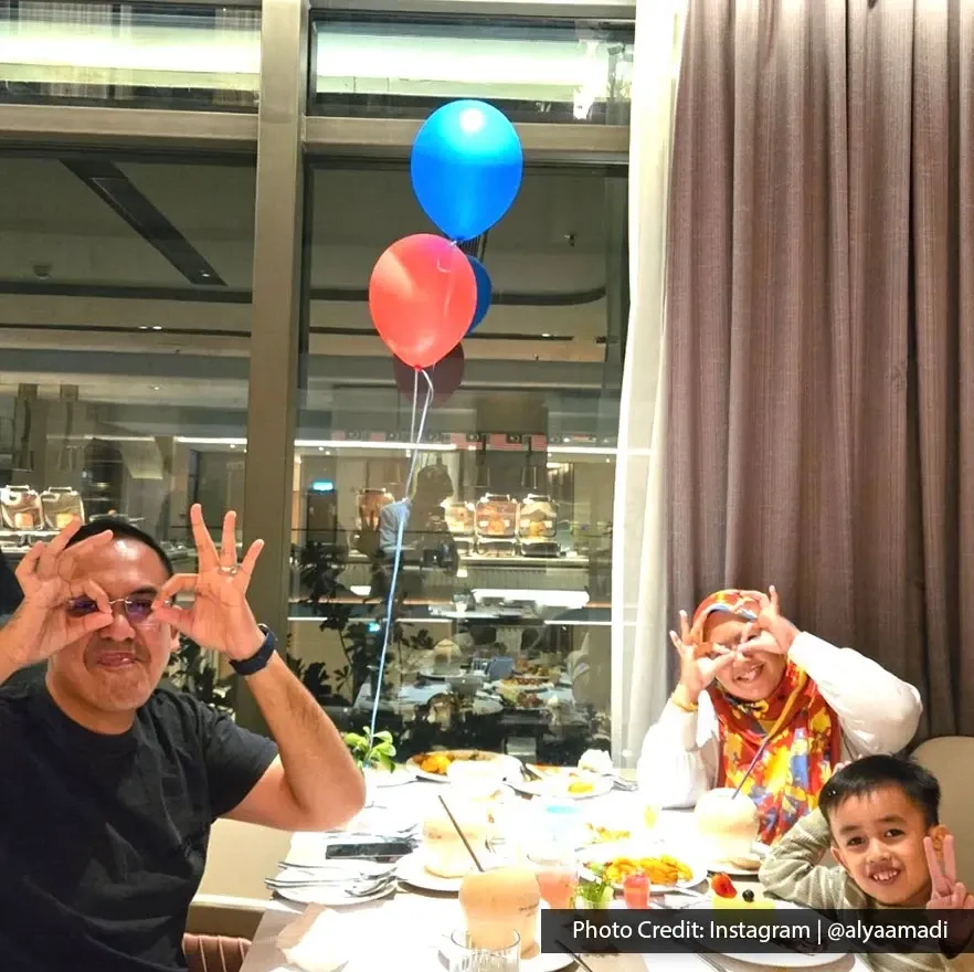 A family enjoying a birthday dining experience during a hotel stay at Imperial Lexis KL.