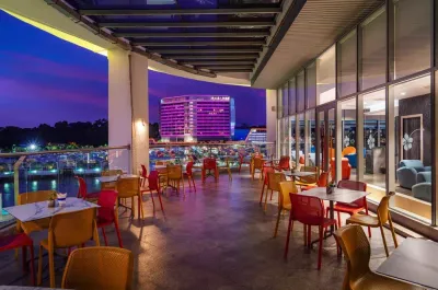 Outdoor seating at Lighthouse Bar with night view - Lexis Hibiscus Port Dickson