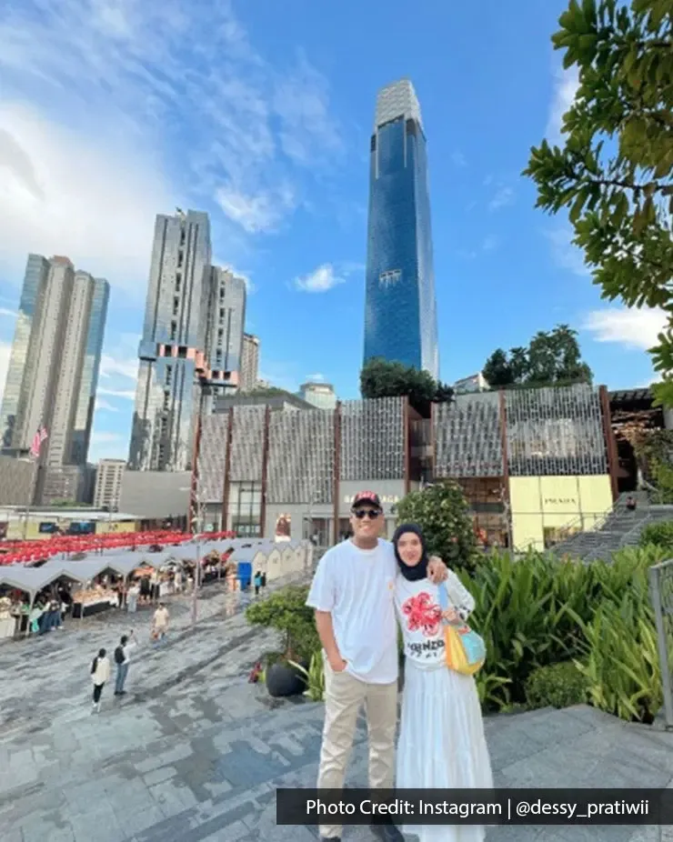 Couple posing with Kuala Lumpur skyline view from The Exchange TRX