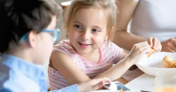 Two children eating at a hotel with family dining options