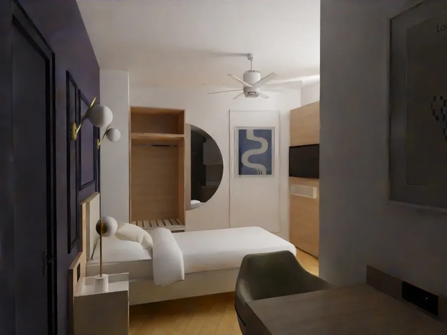 Chambre élégante avec lit, bureau, ventilateur et décoration murale moderne chez Les Sources Callou.