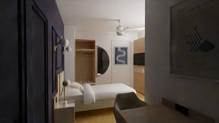 Chambre élégante avec lit, bureau, ventilateur et décoration murale moderne chez Les Sources Callou.