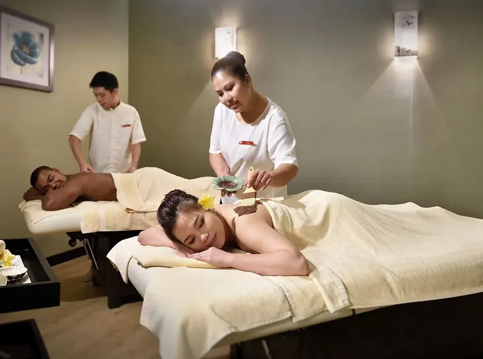 A couple enjoying massages during their weekend staycation in Malaysia - Lexis MY