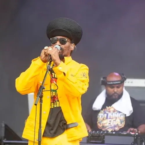 A man in a yellow suit singing Peach at the Beach Music Festival near Showboat Hotel & Resort