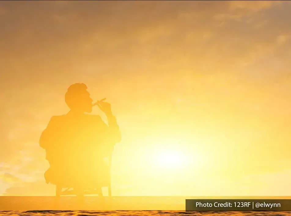 relaxed gentleman embracing the sunset hues - Grand Lexis PD