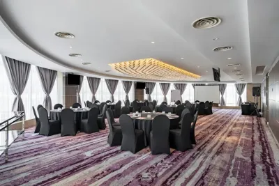 Nautica deck with black chairs and tables – Lexis Hibiscus Port Dickson