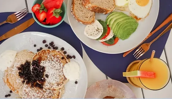 Brunch with pancakes, eggs, avocado and fresh fruit at La Social in Miami’s MiMo District near The Vagabond Hotel