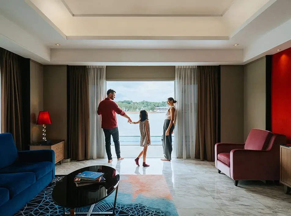 Family enjoying a spacious hotel room with sea views in Port Dickson