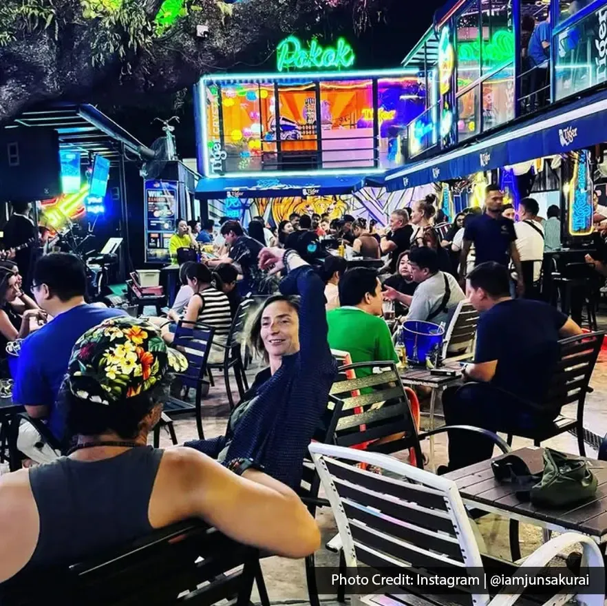 Lively crowd enjoying outdoor seating at The Pokok – All Day Bar.