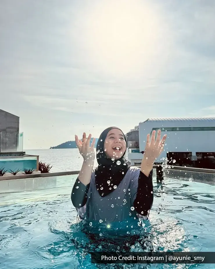 A lady playing in a private pool on her relaxing holiday - Lexis MY
