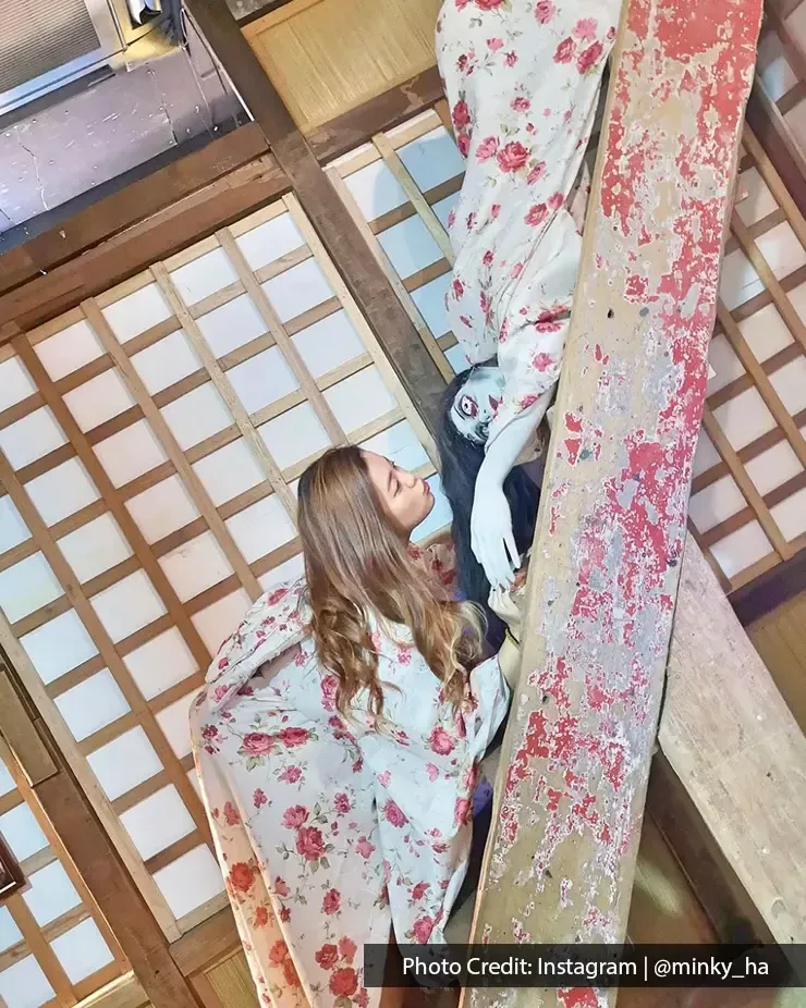 Girl interacting with ghost prop in Ghost Museum Penang – Lexis Suites Penang