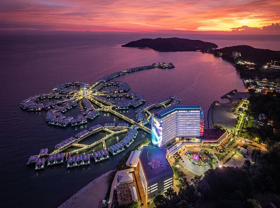 Night aerial view of Lexis Hibiscus with overwater villas.
