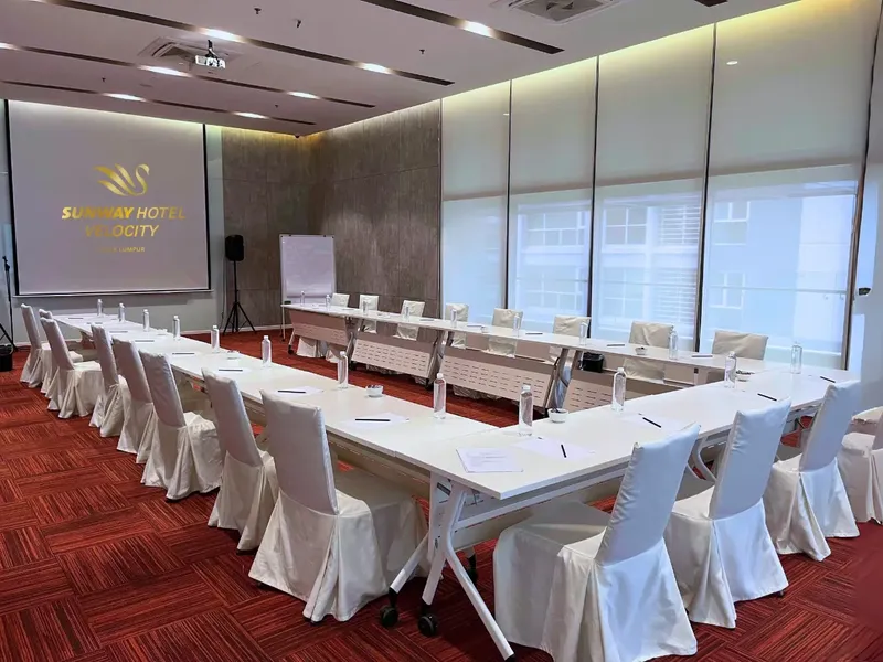 Boardroom set-up with a digital screen in a meeting room at Sunway Velocity Hotel