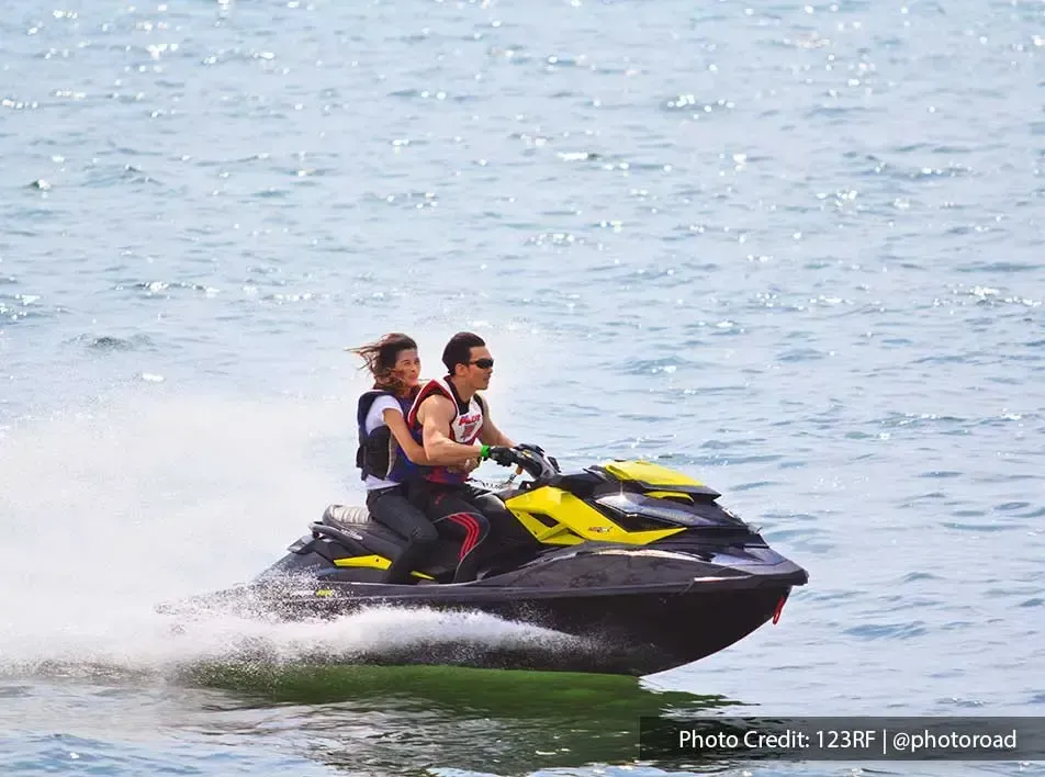 romantic couple riding jet ski - Grand Lexis PD