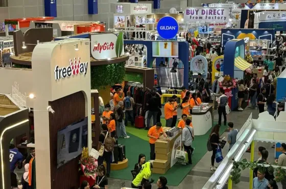  A large indoor exhibit at the Malaysia Gifts Fair, with attendees exploring various products - Imperial Lexis Kuala Lumpur