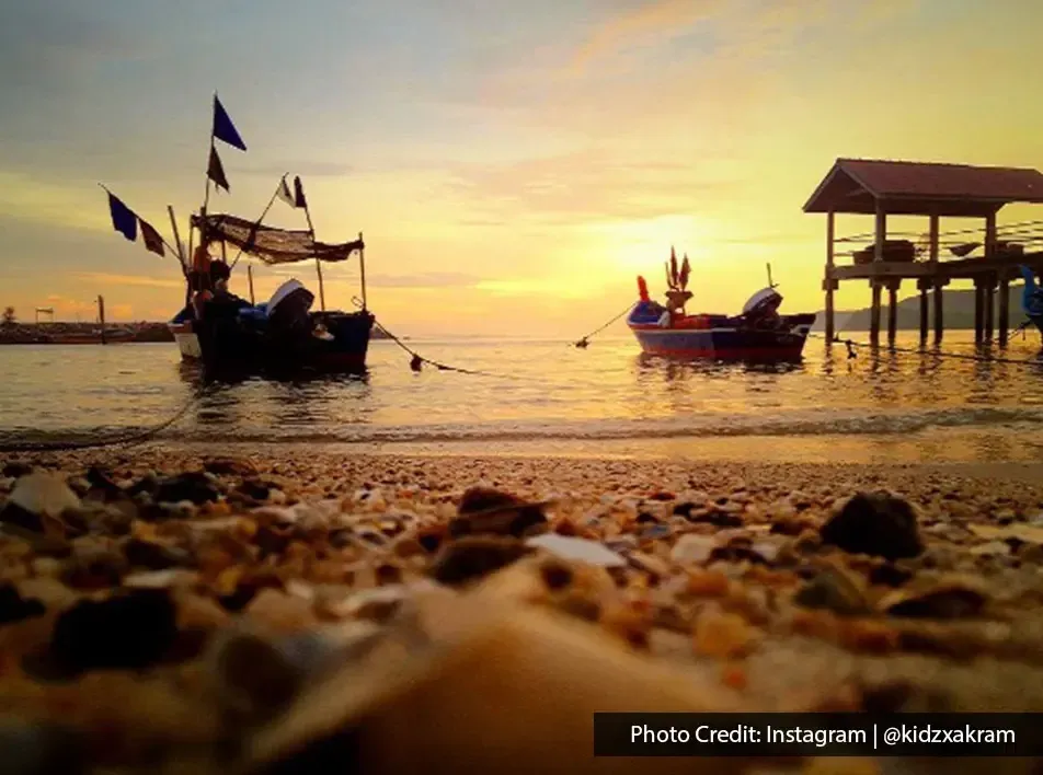 Fishing boats anchored near jetty during sunrise at Sungai Batu Belah