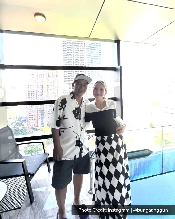 Couple enjoying a romantic getaway by a private pool in Kuala Lumpur.