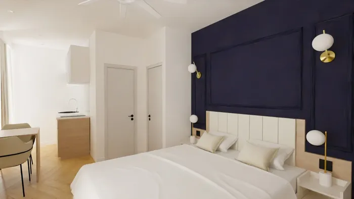 Chambre élégante avec lit double et décoration moderne dans Les Sources Callou.