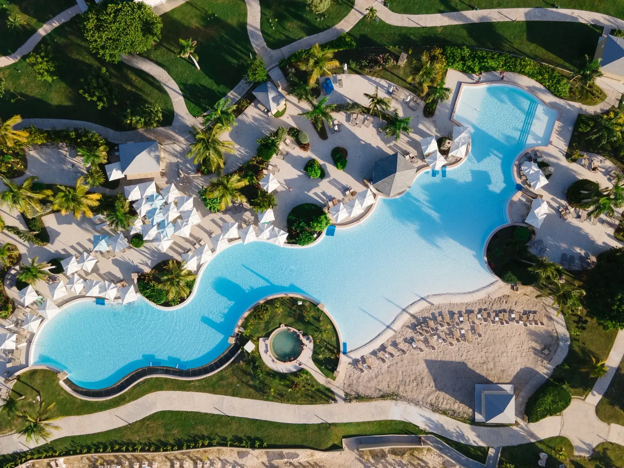 Aerial view of winding pool and Manatees Pool Bar at Saint Martin Beach Resort & Spa, a St. Martin all inclusive resort