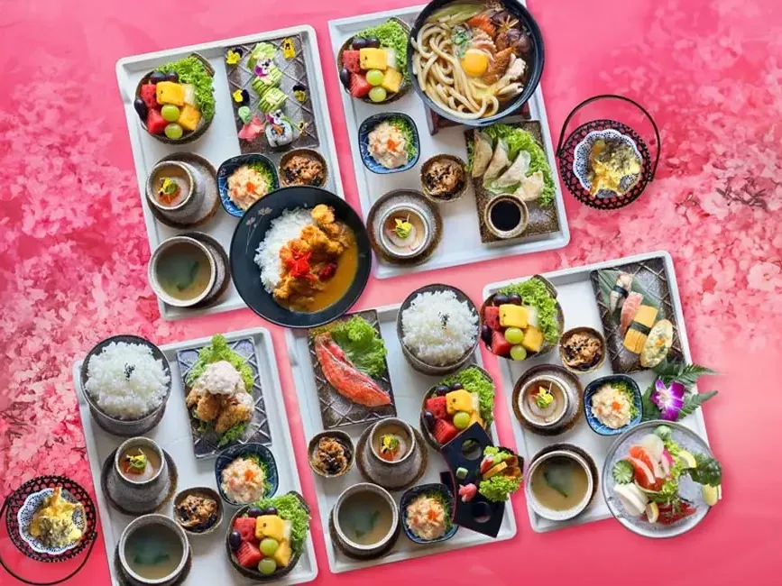 An assortment of Japanese dishes arranged on trays - Lexis Suites Penang